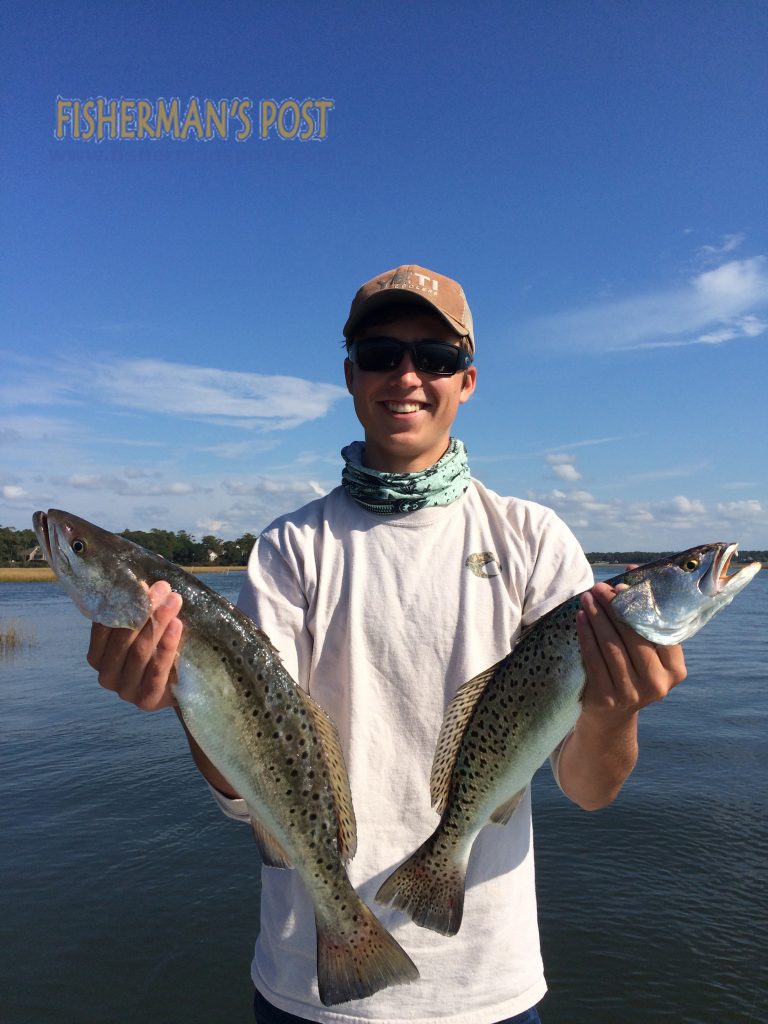 Dylan Lechtrecker (age 16) with a pair of speckled trout that attacked soft plastic baits inshore of Oak Island.