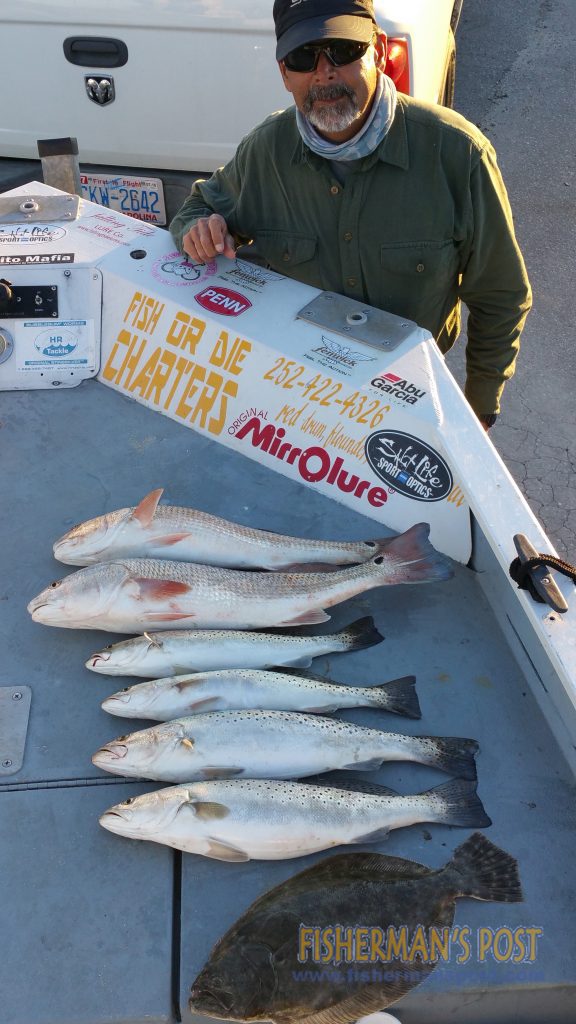 Bill Norris, of Swansboro, NC, with a mixed bag of red drum, spreckled trout, and flounder that struck Z-Man soft plastic baits while he was fishing near Swansboro with Capt. Dale Collins of Fish or Die Charters.